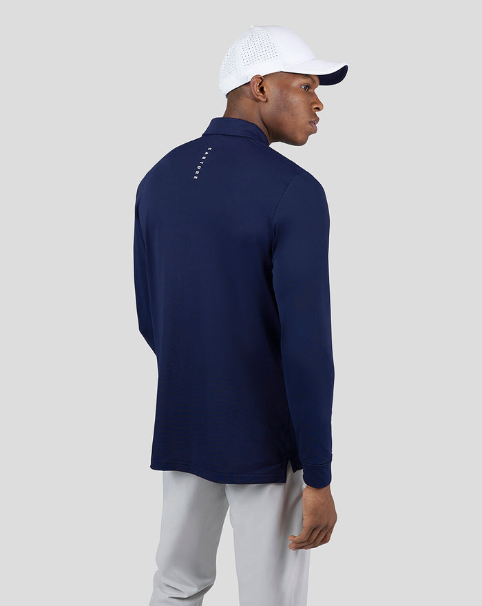 Back view of the navy Essential Long Sleeve Polo showing a vertical logo along the upper back