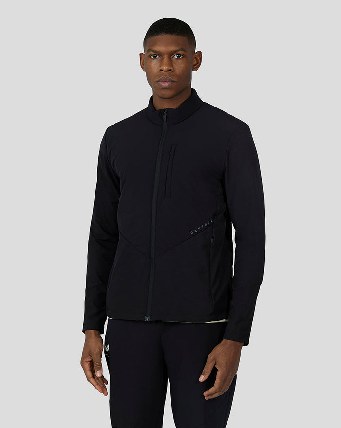 Male model in black carbon capsule hybrid active jacket with stand collar and zipped pockets.