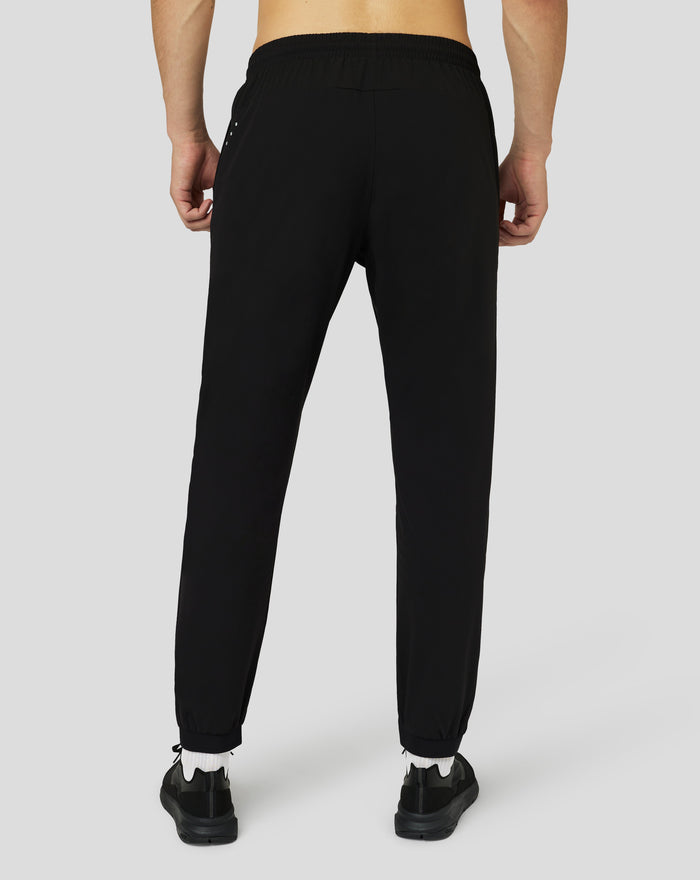 Back view of a person wearing black Protek woven joggers