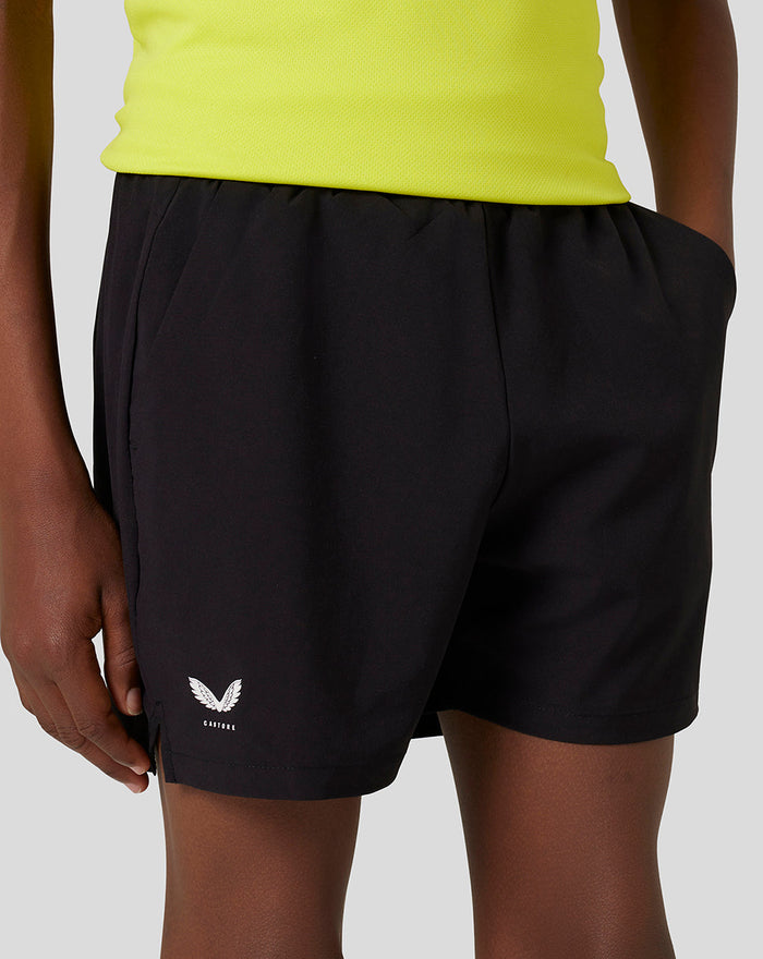 Black junior woven shorts with a white Castore wing logo at the hem