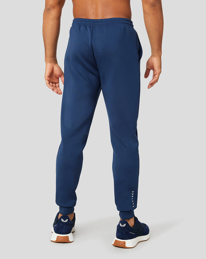 Back view of navy Peacoat Scuba Jogger on a model with a clean silhouette and elastic waistband